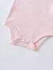 Close-up of a pale pink baby bodysuit showing snap button closure ruffle Short Sleeve Bodysuit - Candy Floss Baby girl