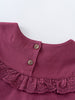 Close-up of a purple collar with buttons on a white background Ruffle Top - Plum Jam Girls