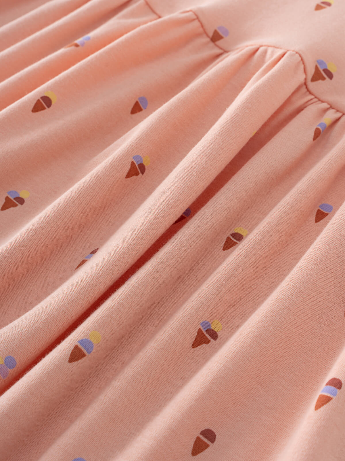 Close-up of pink fabric with small ice cream cone print pattern Short Sleeve Dress - Ice Creams Girls