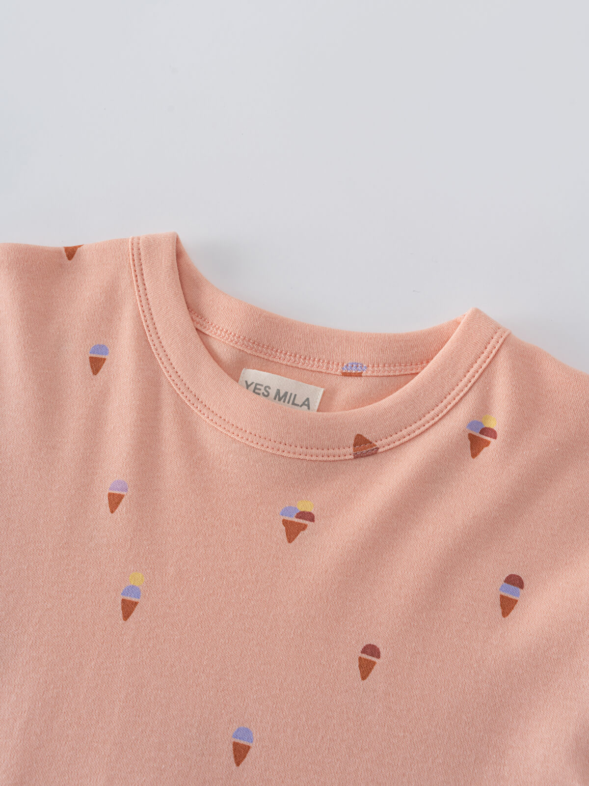 Close-up of pink fabric with small ice cream cone print pattern Short Sleeve Dress - Ice Creams Girls