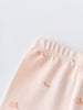 Close-up of pale pink fabric with small apple print pattern Stella Leggings - Apples Baby girl
