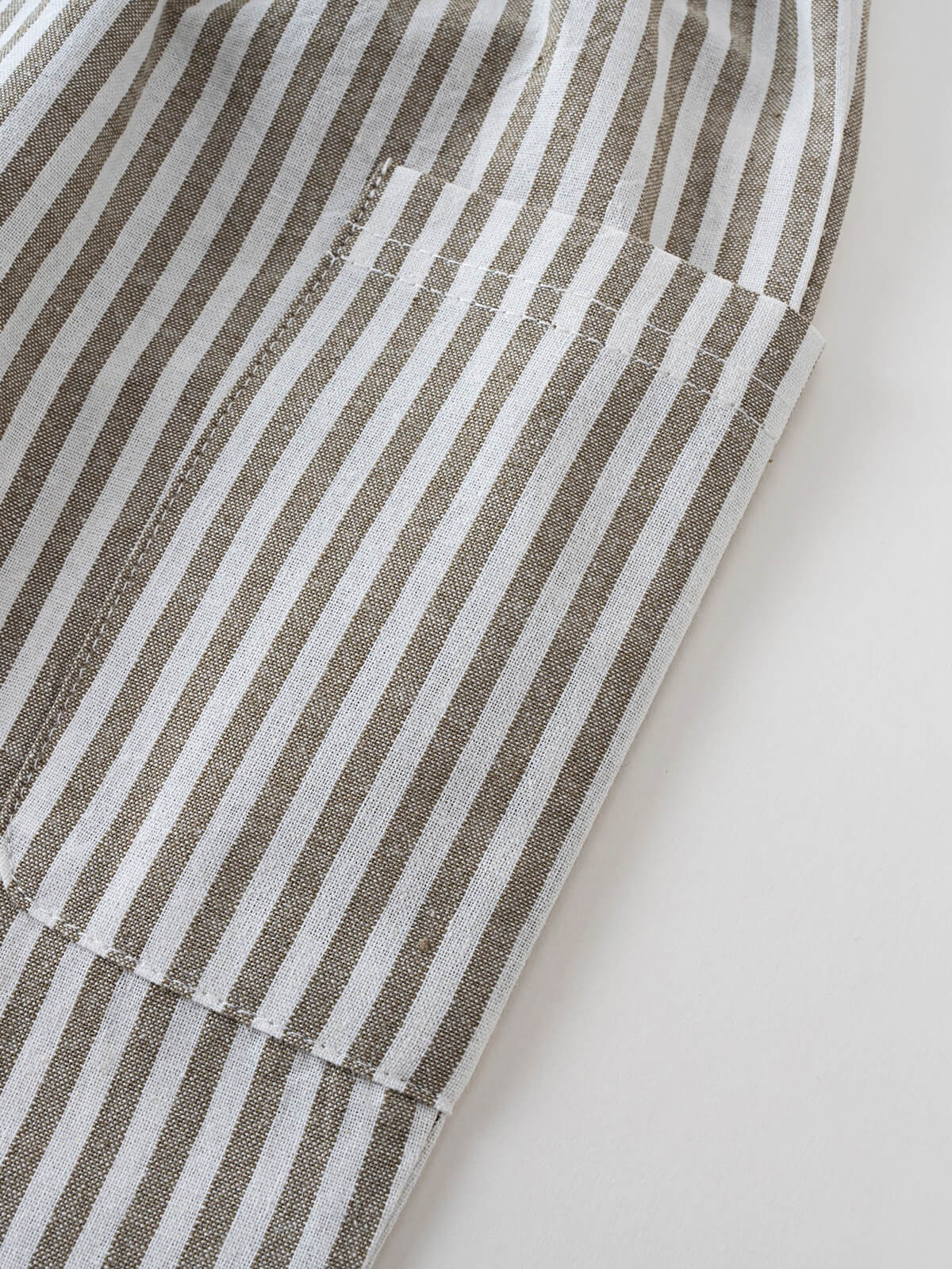 Close-up of striped fabric with vertical brown and white stripes Striped Pants - Matcha Stripe Boys
