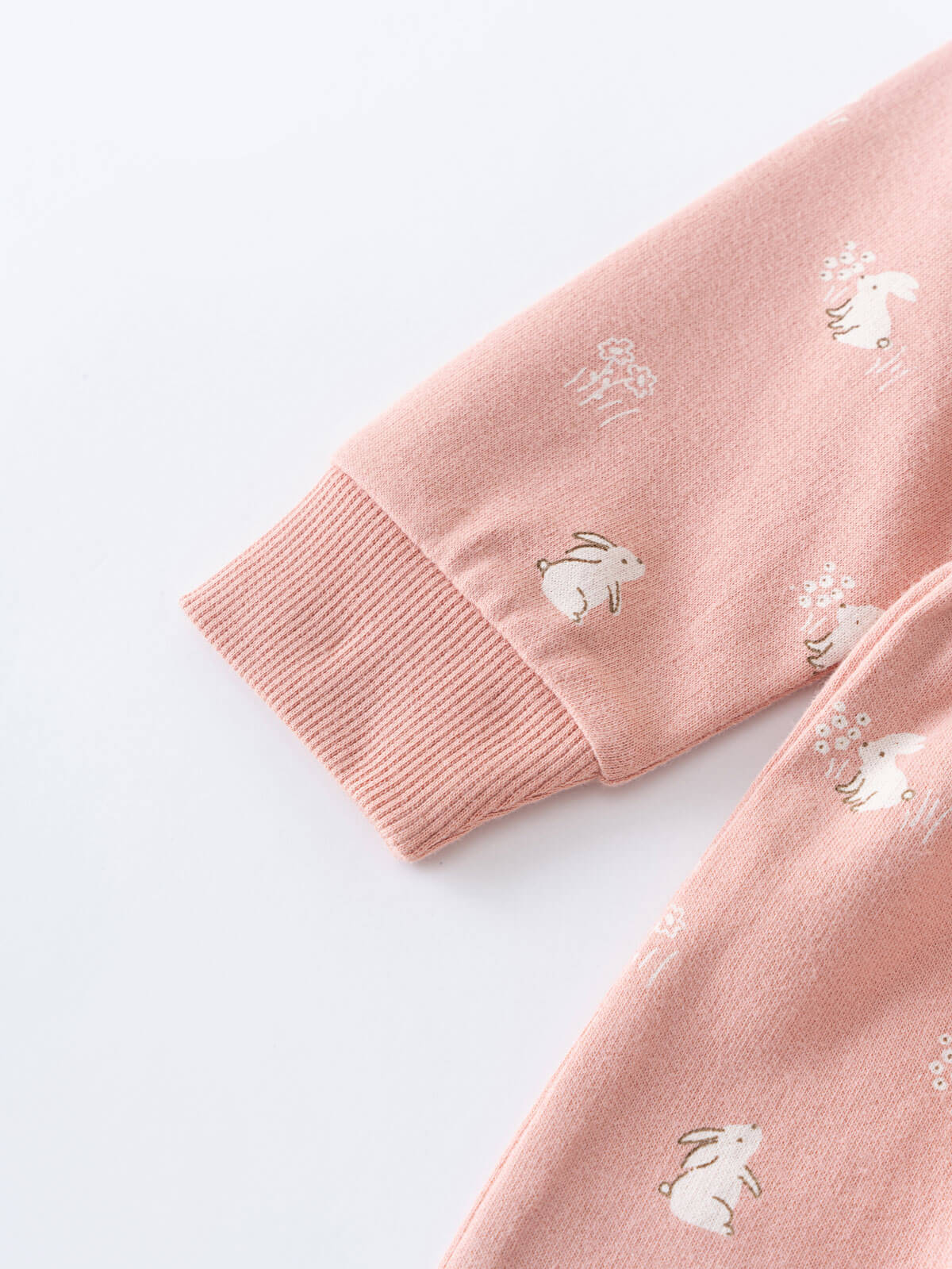 Close-up of pink fabric sleeve with embroidered rabbits and ribbed cuff Baby Sweatshirt Dress - Meadow Friends Blush Baby girl