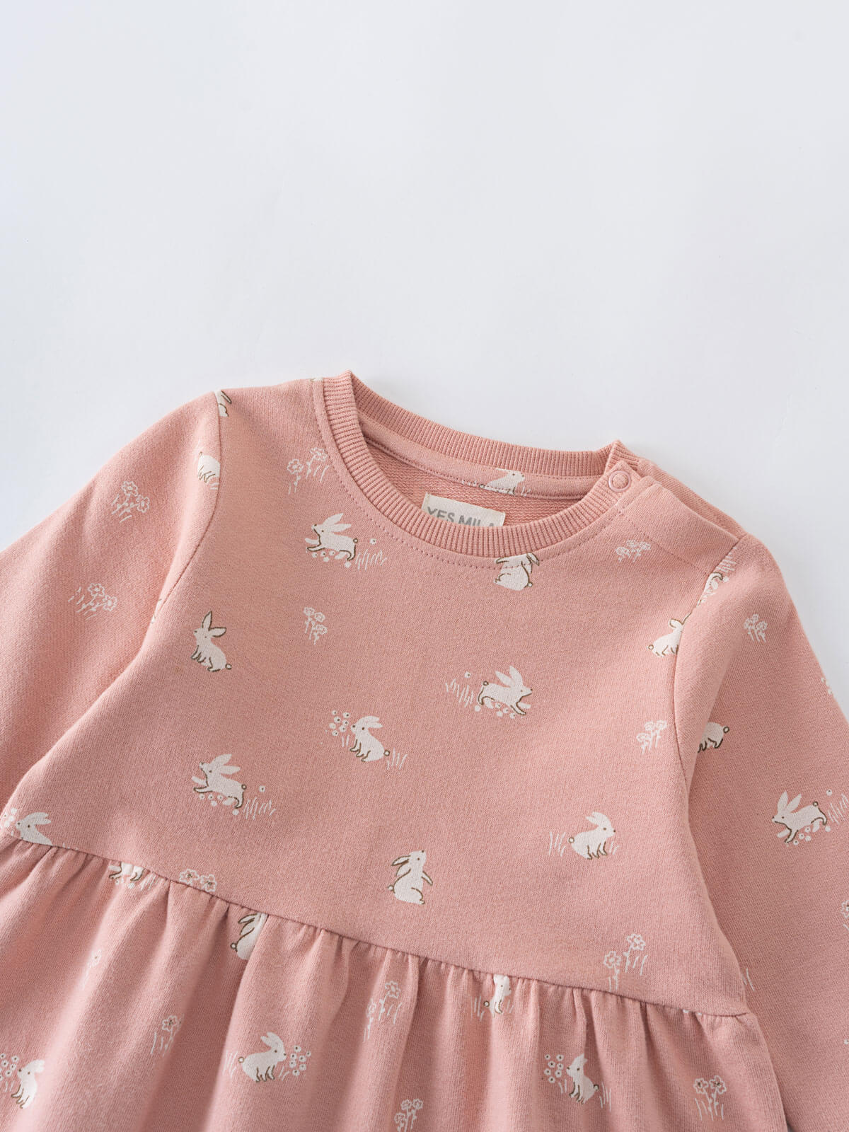 Close-up of pink sweatshirt dress with white rabbit print pattern Baby Sweatshirt Dress - Meadow Friends Blush Baby girl