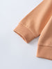 Close-up of peach-colored sweatshirt sleeves showing ribbed cuffs Sweatshirt - Yes Sailing Boys