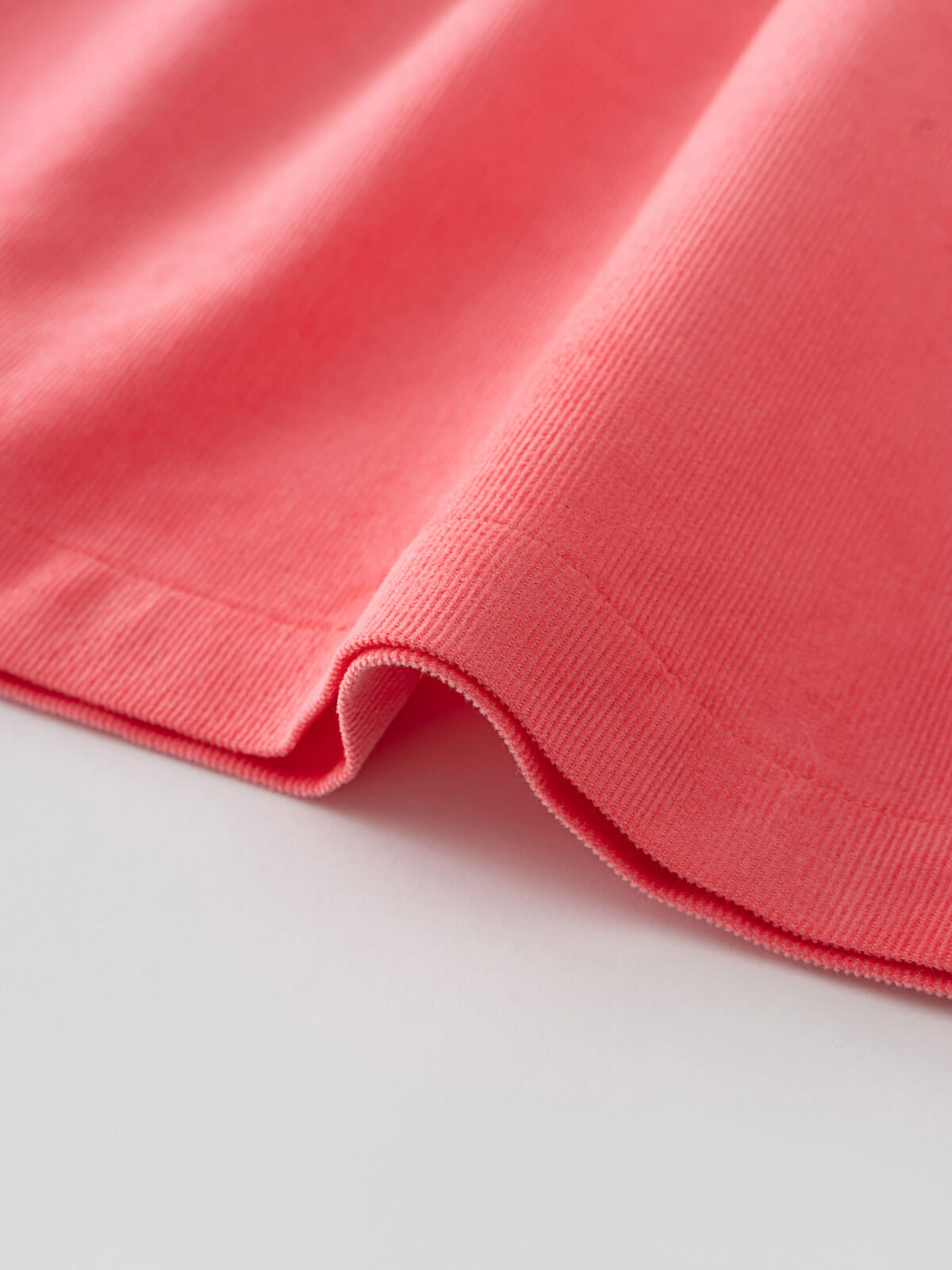 Close-up of a pink fabric with a white background Three Button Blouse - Cloudberry Girls