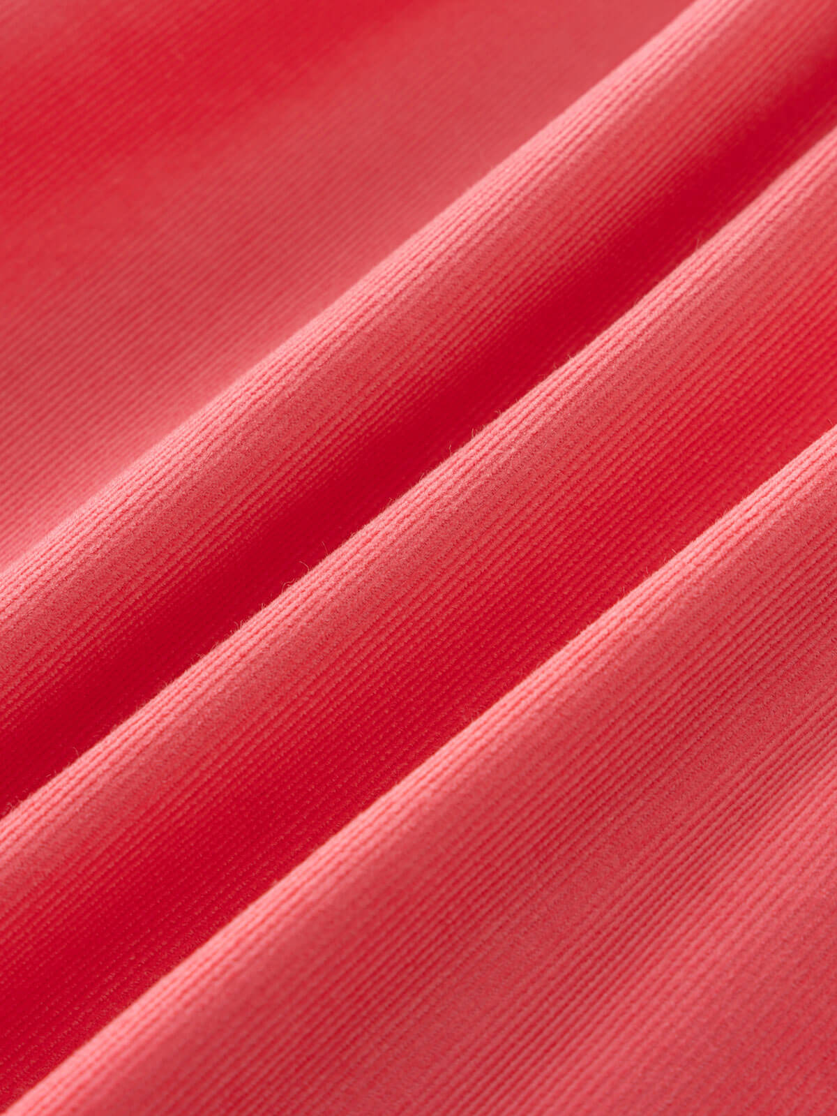 Close-up of pink fabric with a textured pattern Three Button Blouse - Cloudberry Girls