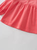 Close-up of a pink blouse with long sleeves on a light gray background Three Button Blouse - Cloudberry Girls