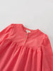 Pink blouse with long sleeves with a label on a light gray background Three Button Blouse - Cloudberry Girls
