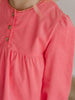 Close-up of a pink long-sleeve top with buttons on a neutral background Three Button Blouse - Cloudberry Girls