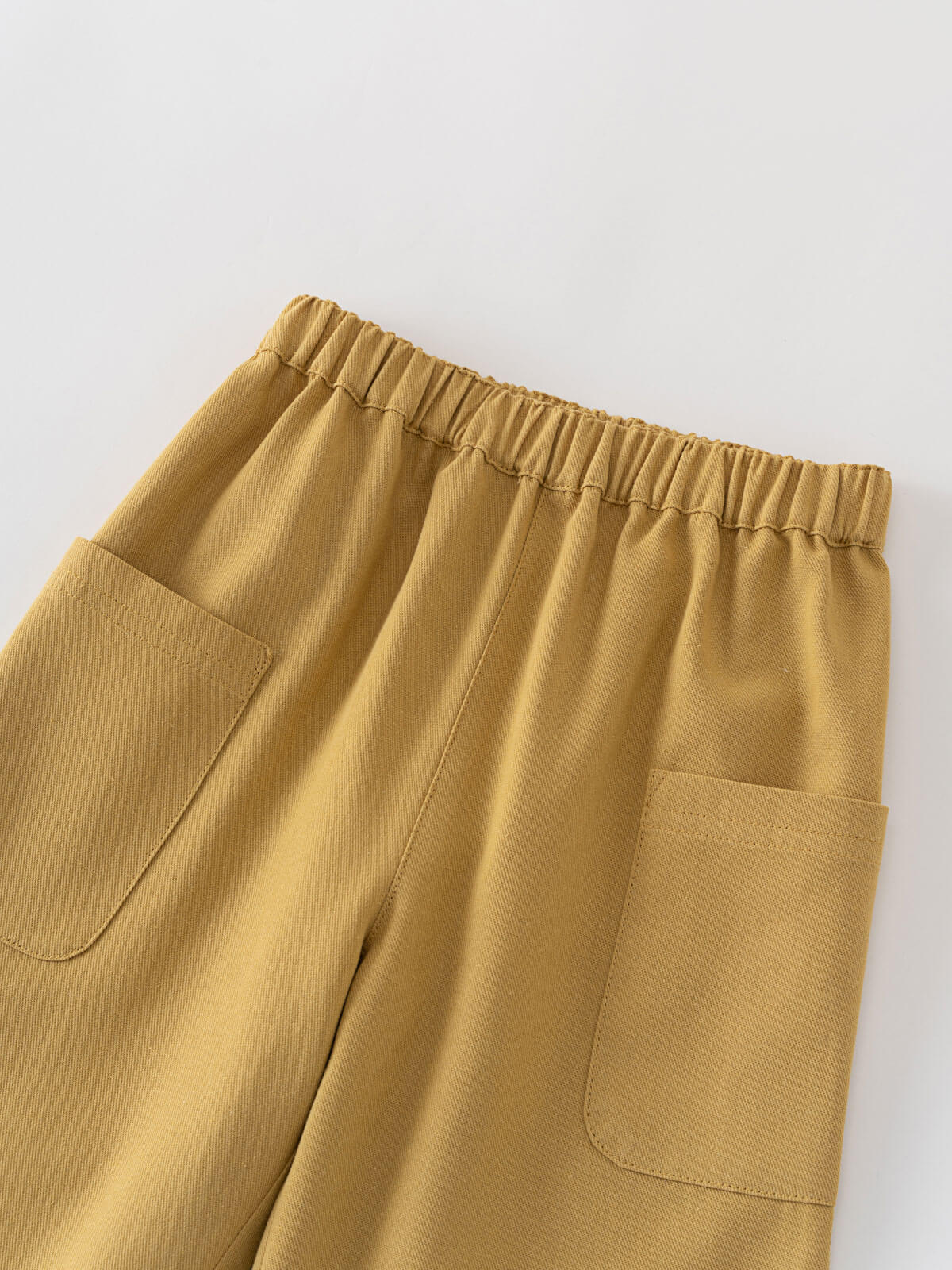 Mustard yellow pants with two front pockets on a light gray background Twill Pants - Golden Pear Boys