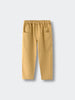Beige pants on a light gray background Twill Pants - Golden Pear Boys