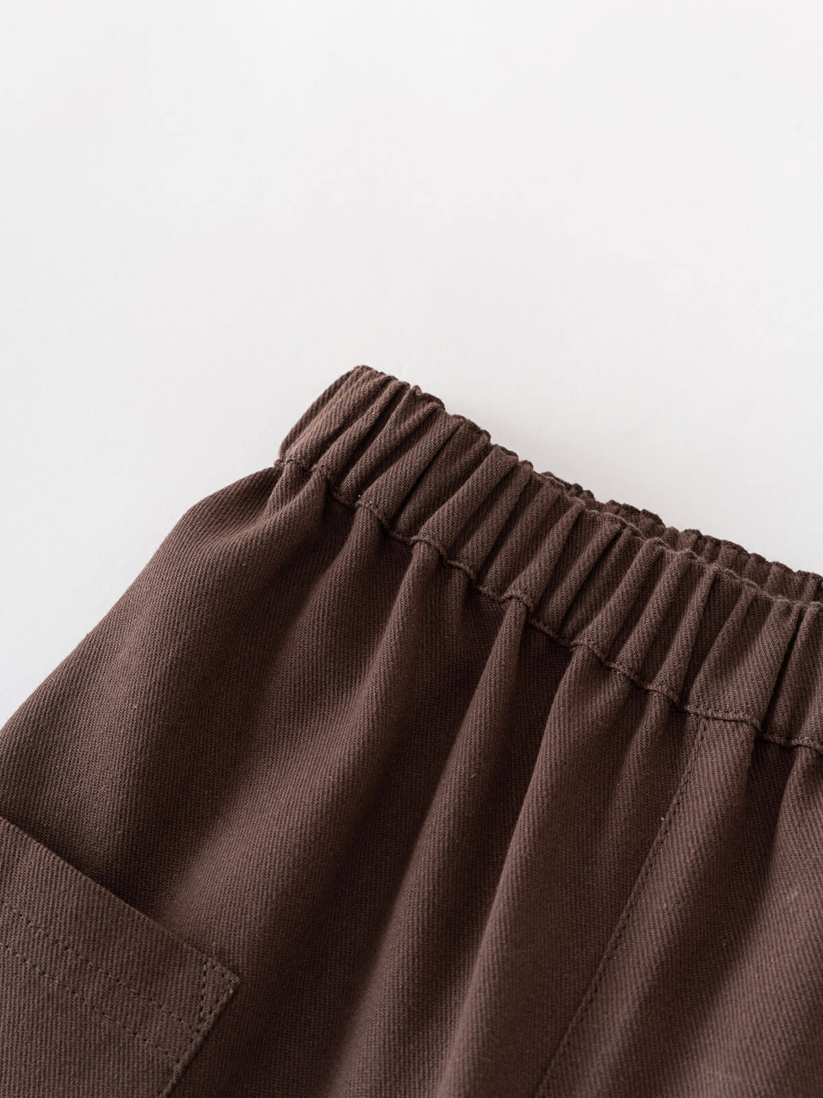 Brown pants with an elastic waistband on a light gray background Twill Pants - Spruce Boys