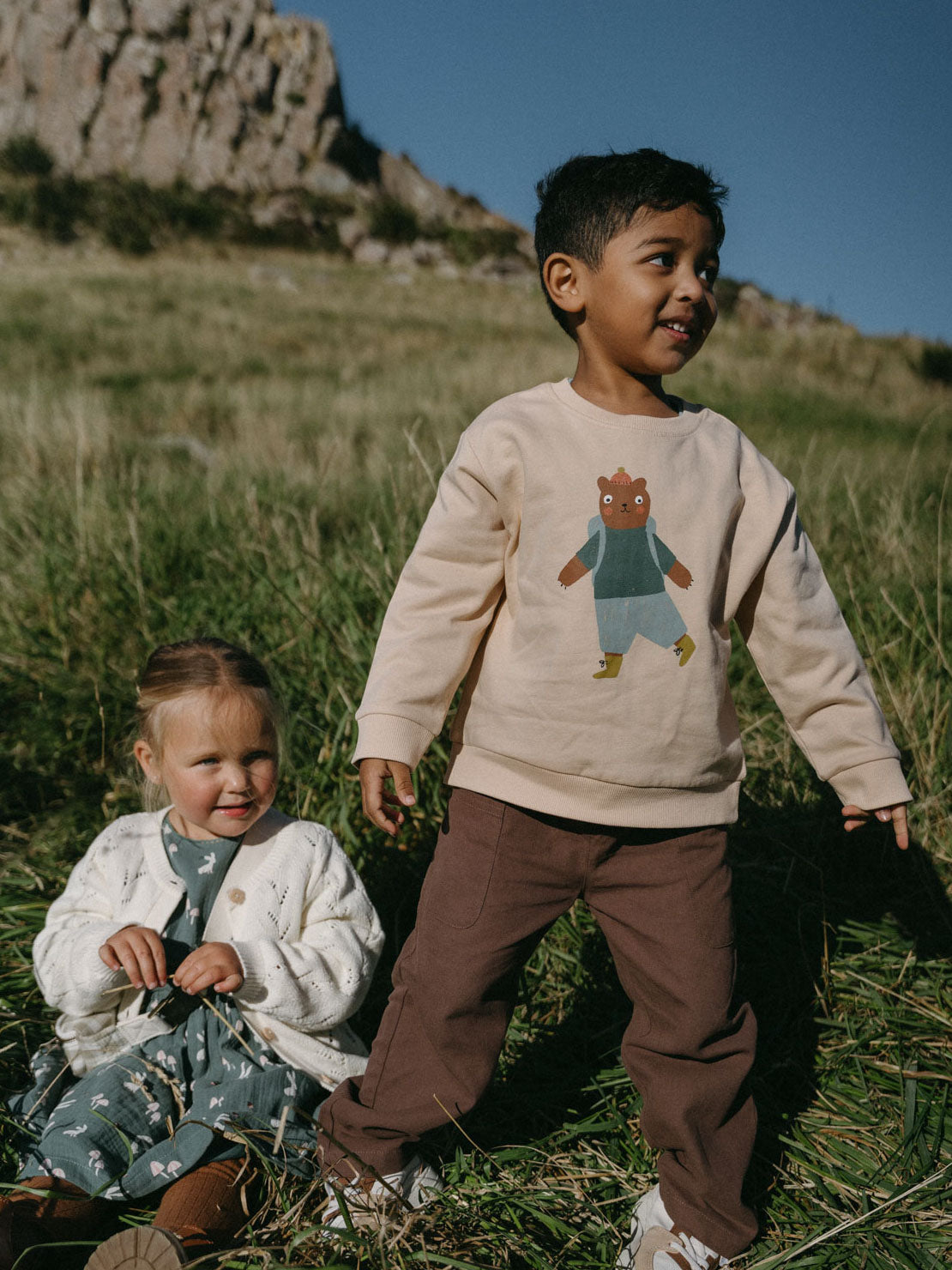 Boy wearing beige sweatshirt with bear graphic and brown pants outdoors Twill Pants - Spruce Boys