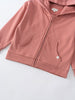 Close-up of a pink zip-up hoodie with front pockets and ribbed hem Zip Hoodie - Rosehip Boys
