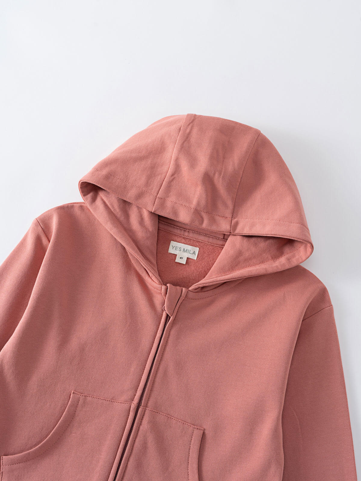 Close-up of a dusty rose colored hoodie with zipper and front pocket Zip Hoodie - Rosehip Boys