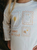 Children's long-sleeve shirt with 'Sunny Day Club' design featuring sun, flowers, and text.